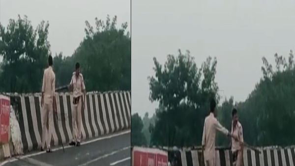 Screengrab Of Bihar Police From The Viral Video Of Them Disposing A Dead Body Into A Canal