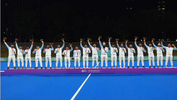 Gold medallist Indian players pose for photos during the presentation ceremony of the mens hockey event at the 19th Asian Games, in Hangzhou, China (PTI Photo) Gold medallist Indian players pose for photos during the presentation ceremony of the mens hockey event at the 19th Asian Games, in Hangzhou, China (PTI Photo)