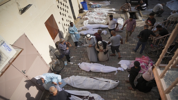 Friends and relatives stand by the bodies of Palestinians killed in the Israeli bombardment of the Gaza Strip at Al-Aqsa Hospital in Deir Al-Balah, Sunday, Oct. 22, 2023 (PTI Photo)
