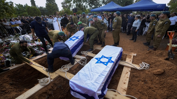 Israeli soldiers carry the coffins of Sgt. Yam Goldstein and her father, Nadav, during their funeral in Kibbutz Shefayim, Israel (PTI Photo) Israeli soldiers carry the coffins of Sgt. Yam Goldstein and her father, Nadav, during their funeral in Kibbutz Shefayim, Israel (PTI Photo)