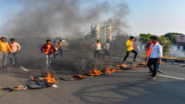 Maratha Kranti Morcha activists burn tyres and other inflamable items during a protest on Pune-Solapur Highway to press for Maratha reservation (PTI Photo)