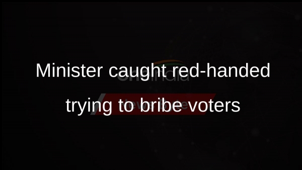 Minister caught red-handed trying to bribe voters