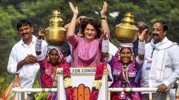 Congress leader Priyanka Gandhi during a roadshow ahead of the Telangana Assembly election, in Khammam