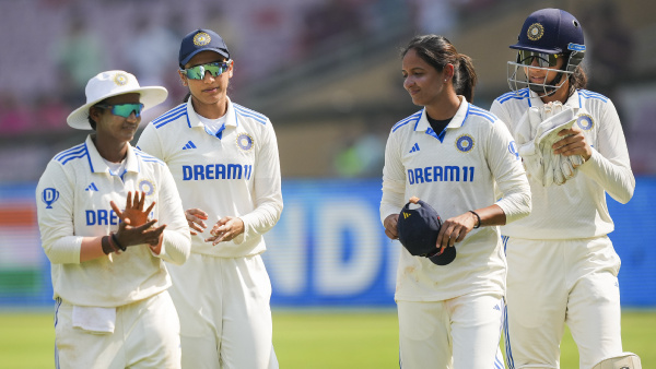 Indian captain Harmanpreet Kaur with teammates after winning the one-off Test cricket match against England, at DY Patil Stadium, in Navi Mumbai