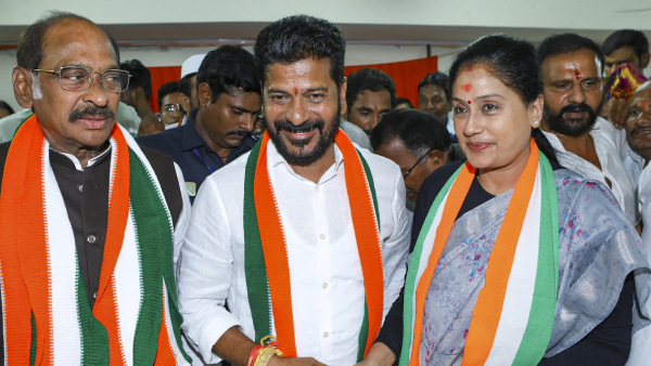 Telangana Congress chief A. Revanth Reddy with party leader Vijayashanti celebrates as party leads during counting of votes for Telangana Assembly elections, in Hyderabad