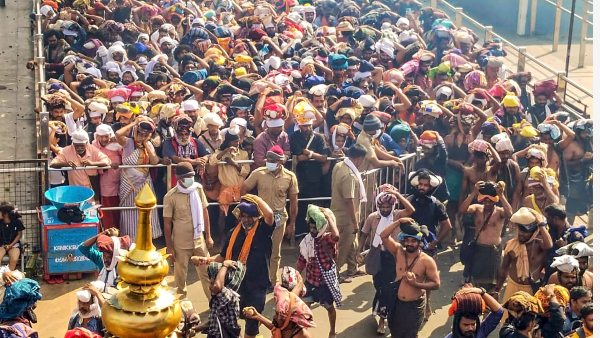 Ayyappa devotees wait to offer prayers at Sabarimala temple, in Pathanamthitta