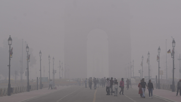 Visitors at the India Gate during a foggy morning in New Delhi Visitors at the India Gate during a foggy morning in New Delhi