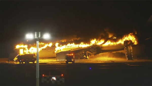 Japan Airlines plane is on fire on the runway of Haneda airport