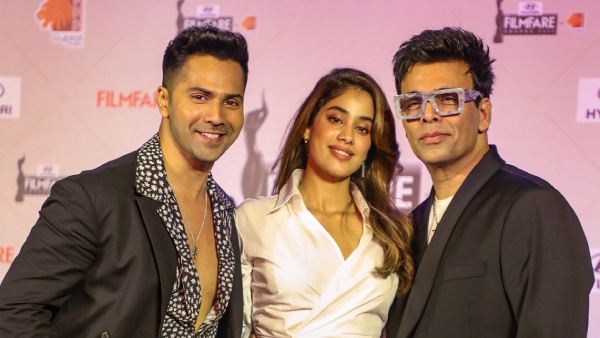 Actors Varun Dhawan, Janhvi Kapoor and film director Karan Johar pose for photos at the press conference for the 69th Filmfare Awards