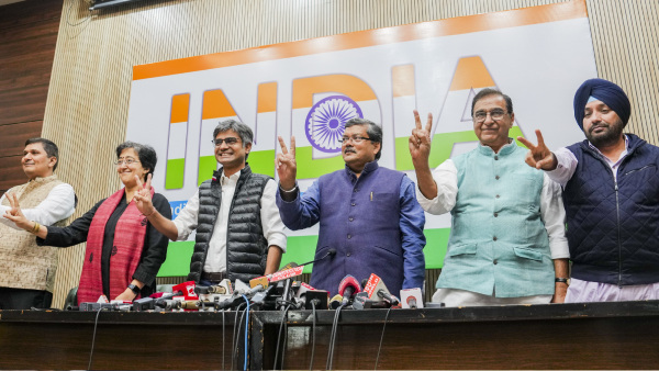 AAP leaders Saurabh Bharadwaj, Atishi Singh and Sandeep Pathak with Congress leaders Mukul Wasnik, Deepak Babaria and Arvinder Singh Lovely during a joint press conference, in New Delhi