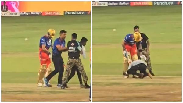 Security Breach At Bengaluru s Chinnaswamy Stadium As Fan Enters Field Hugs Virat Kohli
