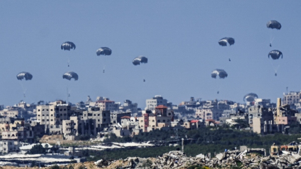 US Military Airdrops Aid To Gaza Amidst Devastation