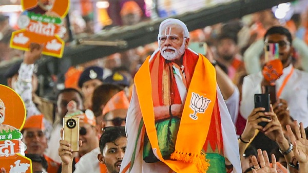 BJP Supporters Holding Prime Minister Narendra Modi s Cutouts