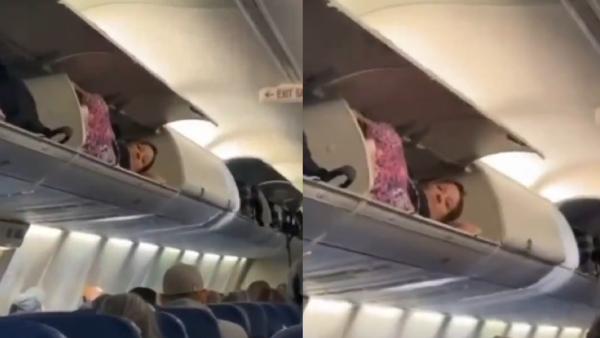 Passenger naps in cabin baggage space Passenger naps in cabin baggage space