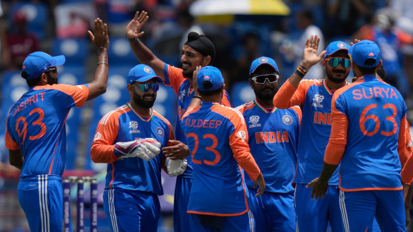 Players of India celebrate the dismissal of Australia s David Warner during an ICC Men s T20 World Cup cricket match at Darren Sammy National Cricket Stadium in Gros Islet Saint Lucia Monday June 24 2024