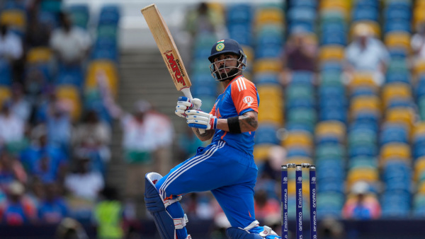 Virat Kohli watches the ball after playing a shot during the ICC Men s T20 World Cup final cricket match between India and South Africa at Kensington Oval in Bridgetown