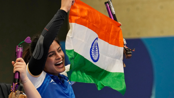 Manu Bhaker celebrates with the Indian flag after winning the bronze medal in the 10m air pistol women s final round at the 2024 Summer Olympics Sunday July 28 2024 in Chateauroux France Manu Bhaker celebrates with the Indian flag after winning the bronze medal in the 10m air pistol women s final round at the 2024 Summer Olympics Sunday July 28 2024 in Chateauroux France