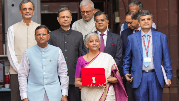 Union Finance Minister Nirmala Sitharaman poses with the case carrying the Union Budget 2024 at Finance Ministry North Block in New Delhi Tuesday July 23 2024