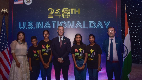 U S Ambassador to India Eric Garcetti center U S Consul General in Chennai Chris Hodges and his wife Joycelyn Narayan pose for a photo with participants of 2024 WiSci Women in Science South Asia Camp at the 248th anniversary of U S National Day in Chennai on Thursday July 18 2024