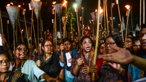 People take part in a torch rally to protest against the sexual assault and murder of a postgraduate trainee doctor in Kolkata Wednesday night Aug 14 2024