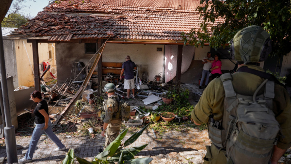 Israeli security forces and residents examine a house that was hit by a rocket fired from Lebanon in Kibbutz Saar northern Israel on Wednesday Sept 25 2024