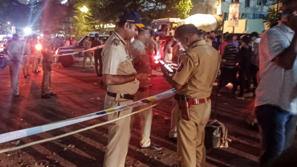 Police personnel cordon off an area after an unidentified person fired at and injured NCP Ajit Pawar leader Baba Siddiqui at Bandra East area in Mumbai Saturday Oct 12 2024