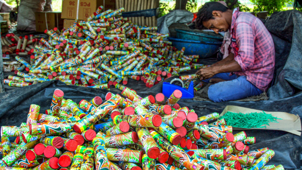 Workers pack different crackers for upcoming Diwali festival in Ahmedabad Saturday Oct 26 2024