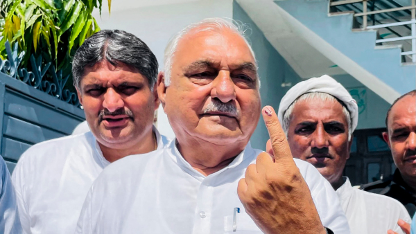 Haryana Assembly Leader of Opposition Bhupinder Singh Hooda shows his ink-marked finger after casting his vote during Haryana Assembly elections Haryana Assembly Leader of Opposition Bhupinder Singh Hooda shows his ink-marked finger after casting his vote during Haryana Assembly elections