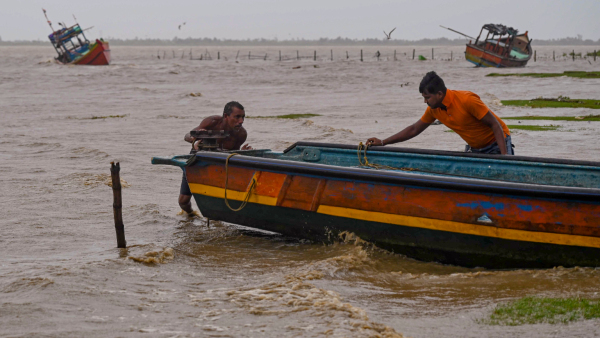 Fishermen bring their boat to the dock after the water level of Dhamra river swelled in view of cyclone Dana which is expected to make landfall in Odisha at Dhamra in Bhadrak district of Odisha Thursday Oct 24 2024