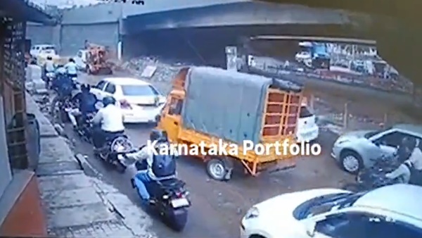 Bengaluru s Brand Exposed Goods Vehicle Overturns As It Tries To Avoid Pothole In Nagavara