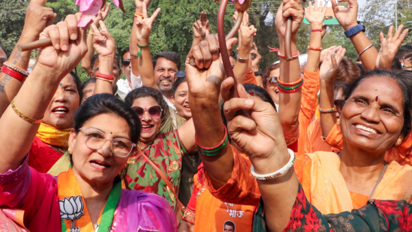 BJP women workers hold lotus while celebrating NDA s win Maharashtra Assembly elections in Nagpur Saturday Nov 23 2024