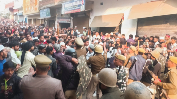 Police and security personnel interact with locals protesting during a second survey of the Jama Masjid claimed to be originally the site of an ancient Hindu temple in Sambhal Sunday Nov 24 2024 Police used tear gas and minor force in the face of stone pelting by locals on Sunday as tension escalated during the survey of the Mughal-era mosque