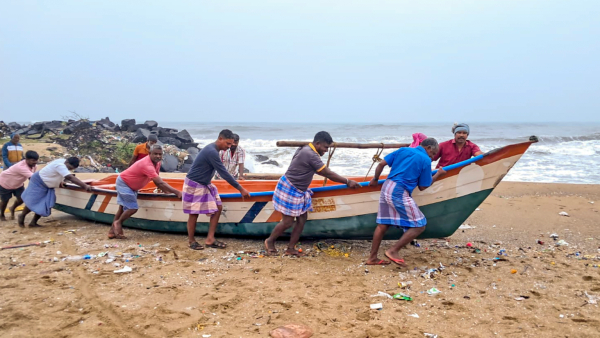 Fishermen move a boat away from the sea amidst a warning issued by the India Meteorological Department IMD that a deep depression over the southwest Bay of Bengal is likely to intensify into Cyclone Fengal and move towards Tamil Nadu in Mayiladuthurai Tamil Nadu Wednesday Nov 27 2024