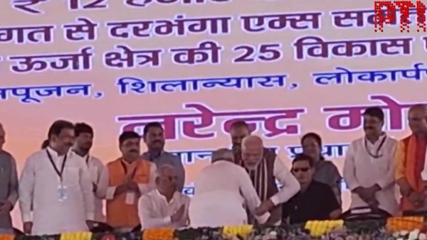WATCH Video CM Nitish Stuns With Public Gesture Touches PM Modi s Feet At Darbhanga Event