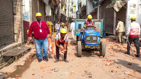 Workers remove brick bats from a road after violence erupted during the second survey of the Jama Masjid claimed to be originally the site of an ancient Hindu temple in Sambhal Sunday Nov 24 2024 Workers remove brick bats from a road after violence erupted during the second survey of the Jama Masjid claimed to be originally the site of an ancient Hindu temple in Sambhal Sunday Nov 24 2024