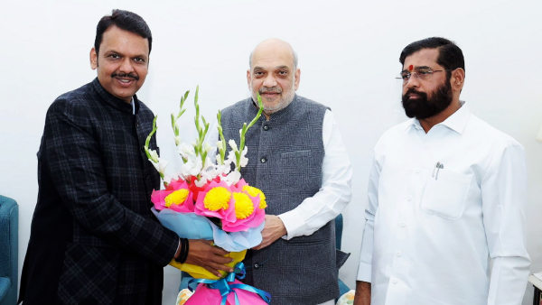 Union Minister and senior BJP leader Amit Shah Maharashtra BJP leader Devendra Fadnavis Shiv Sena leader Eknath Shinde exchange greetings during a meeting at Nadda s residence in New Delhi Thursday Nov 28 2024