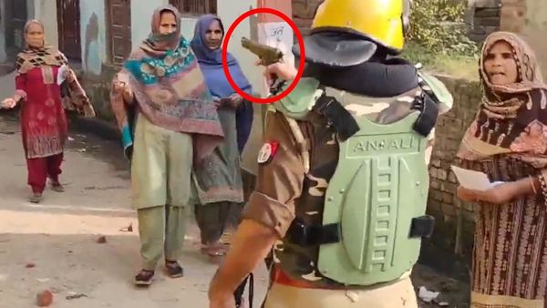 Policeman Stops Voters With A Gun