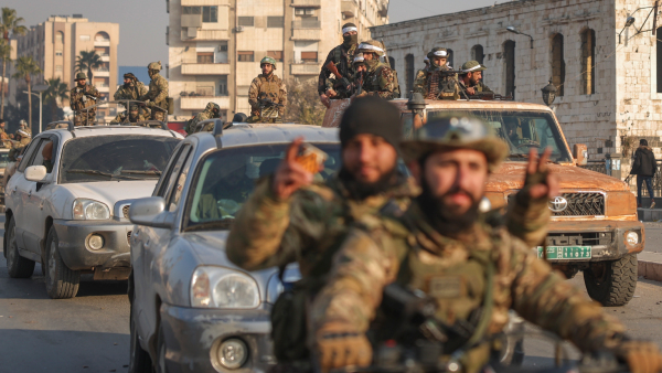 Syrian opposition fighters ride along the streets in the aftermath of the opposition s takeover of Hama Syria Friday Dec 6 2024