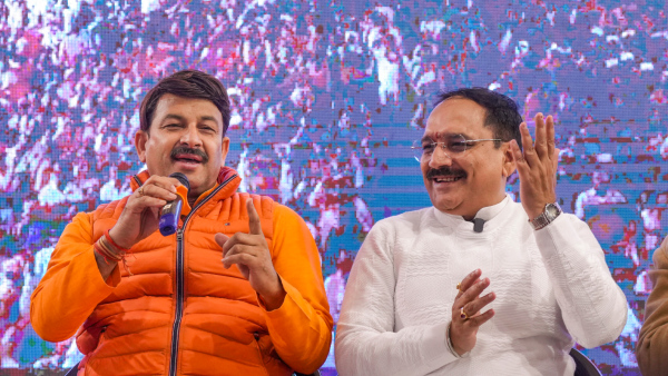 BJP MP Manoj Tiwari left and the party s Delhi President Virender Sachdeva during the launch of their campaign song for the upcoming Delhi Assembly elections in New Delhi Saturday Jan 11 2025