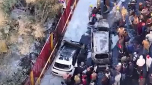 A drone shot shows rescue operation being conducted after a fire erupted in two parked vehicles on the main road leading to the Mahakumbh Mela Prayagraj Saturday Jan 25 2025