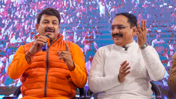 BJP MP Manoj Tiwari left and the party s Delhi President Virender Sachdeva