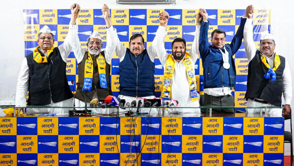 AAP leader Sanjay Singh with former MLA of Kondli Assembly constituency Amrish Singh Gautam 2nd from left after he joined the party ahead of Delhi Assembly elections in New Delhi