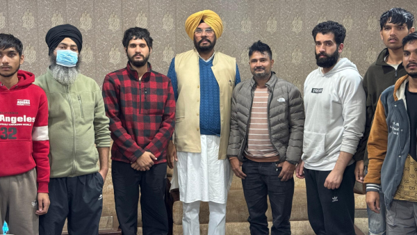 Punjab NRI Affairs minister Kuldeep Singh Dhaliwal seen with deported Indians from US Punjab NRI Affairs minister Kuldeep Singh Dhaliwal seen with deported Indians from US