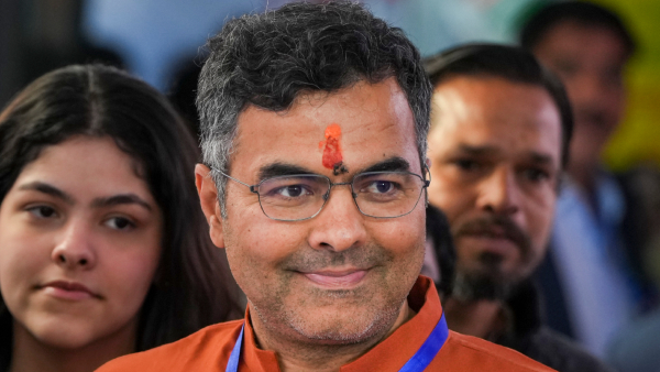 BJP candidate Parvesh Sahib Singh Verma shows his finger marked with indelible ink after casting his vote at a polling booth during the Delhi Assembly elections in New Delhi Wednesday Feb 5 2025