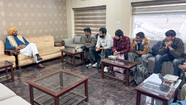 Punjab NRI Affairs Minister Kuldeep Singh Dhaliwal left interacts with illegal Indian immigrants who were deported from the US upon their arrival in Amritsar Wednesday Feb 5 2025 A US military aircraft carrying 104 illegal Indian immigrants landed at the airport on Wednesday afternoon sources said