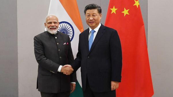 Prime Minister Narendra Modi shakes hands with Chinese President Xi Jinping during a meeting on the sidelines of BRICS Summit in Brasilia Brazil Wednesday Nov 13 2019
