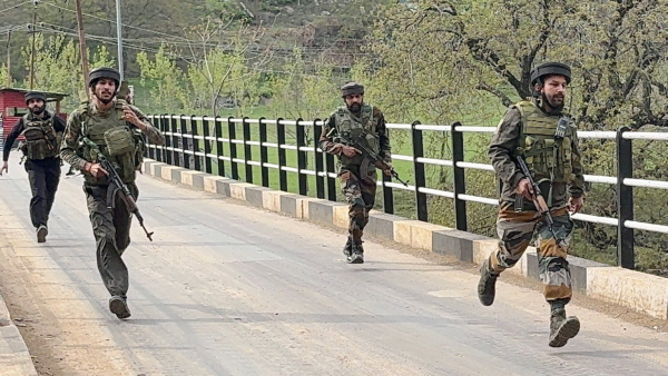 Security personnel rush to the spot after terrorists attacked a group of tourists at Pahalgam in Anantnag district Jammu amp amp Kashmir Tuesday April 22 2025
