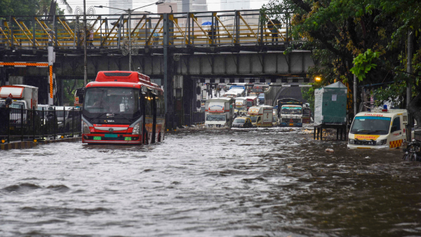 Vehicles move on a flooded road after heavy monsoon rainfall in Mumbai Monday May 26 2025