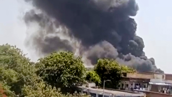 Smoke billows after a plane crashed and caught fire in Meghaninagar area near Ahmedabad airport Thursday June 12 2025 Smoke billows after a plane crashed and caught fire in Meghaninagar area near Ahmedabad airport Thursday June 12 2025