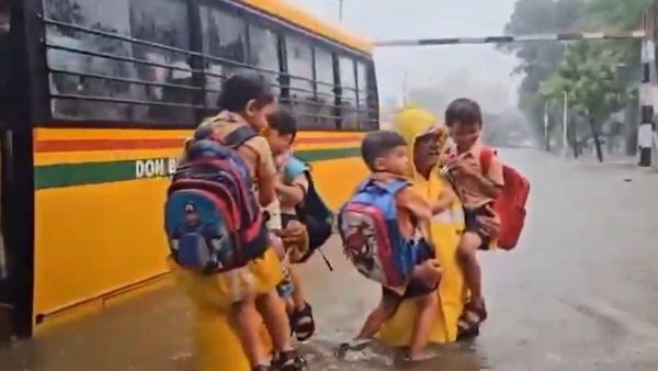 Mumbai police officers rescued seven children and staff from a flooded bus Mumbai police officers rescued seven children and staff from a flooded bus